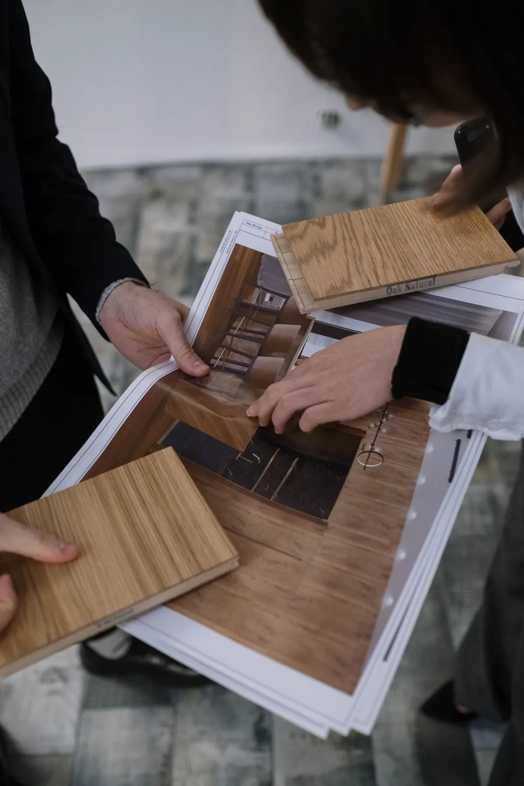 Reviewing wood samples with plans