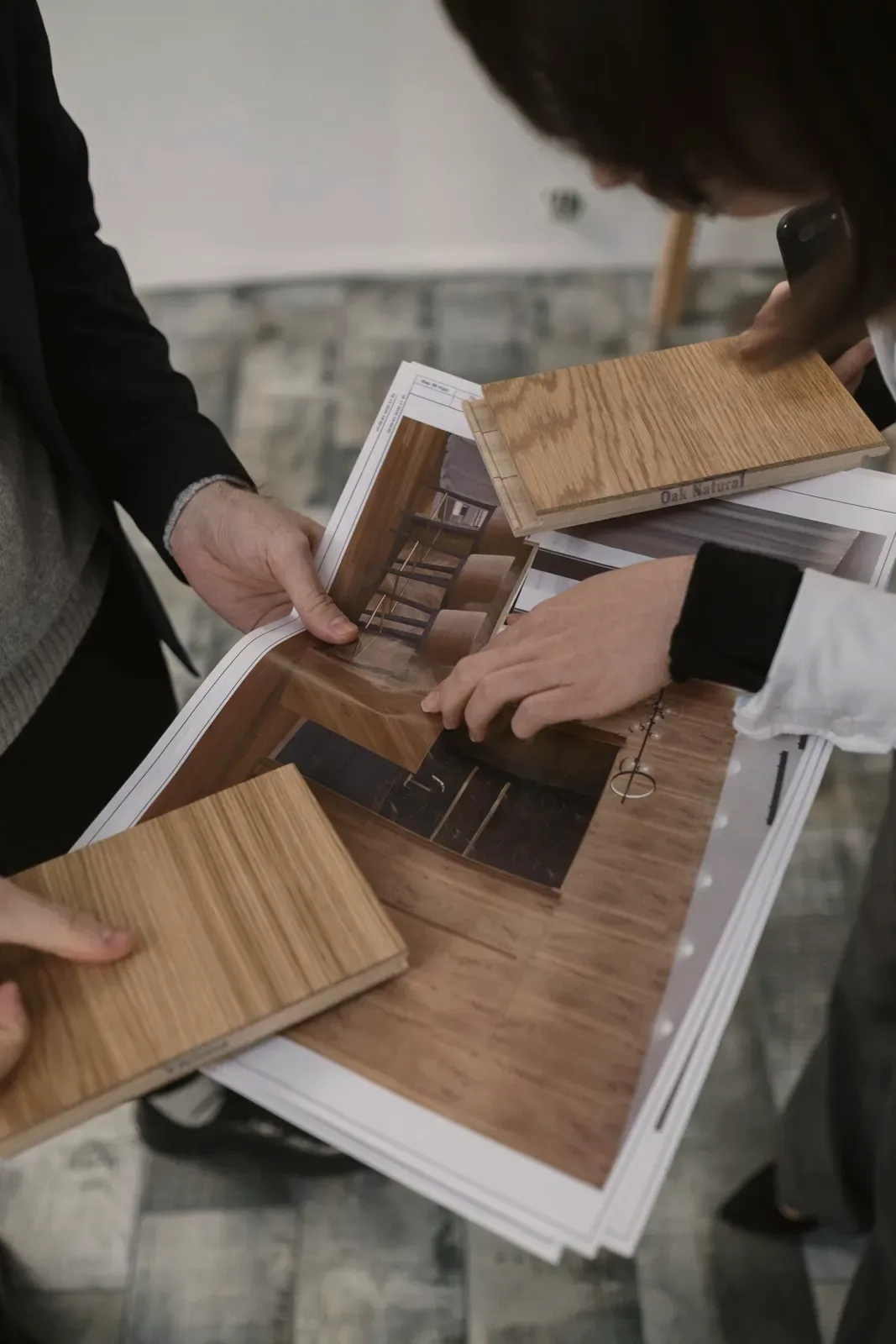 Reviewing wood samples with plans