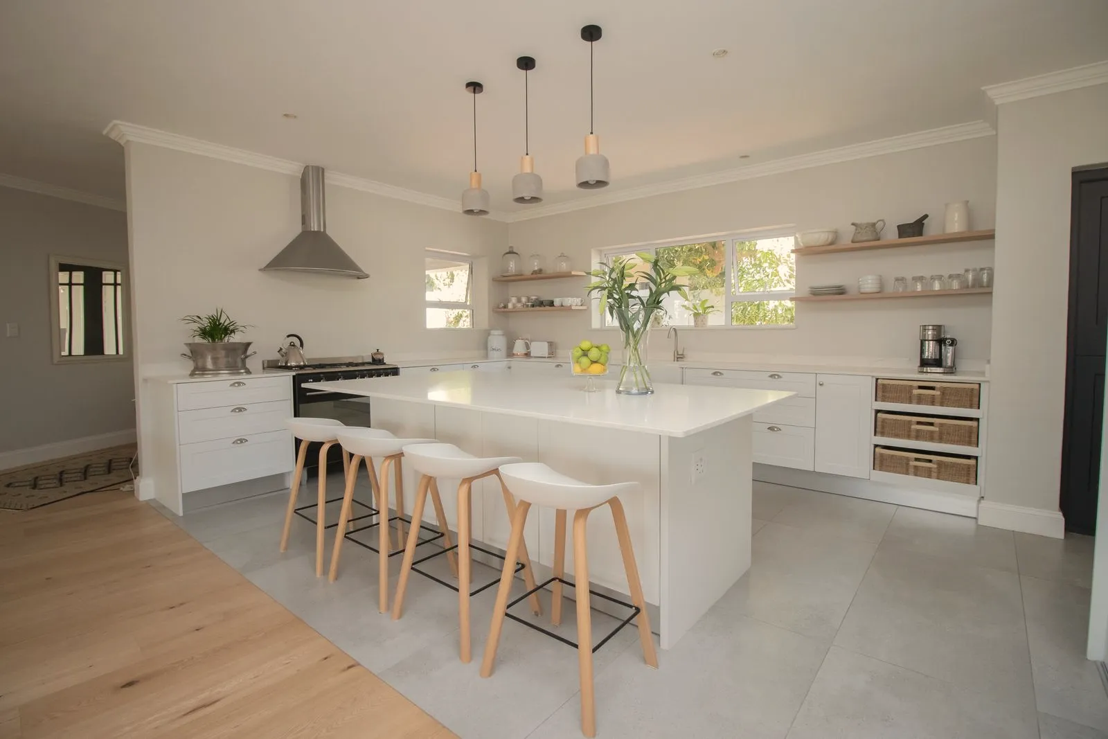 Bright modern kitchen with island and pendant lights